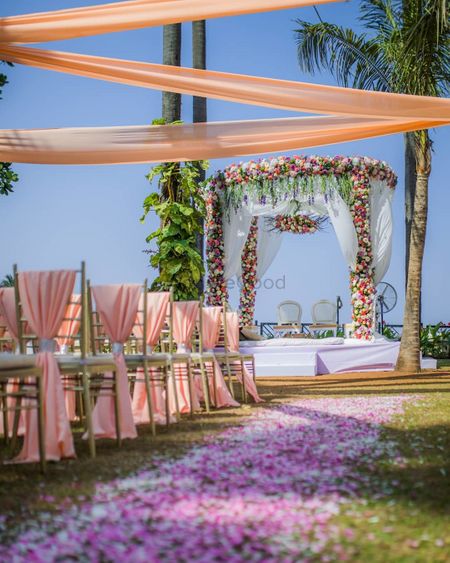 Floral walkway leading to a stunning floral mandap