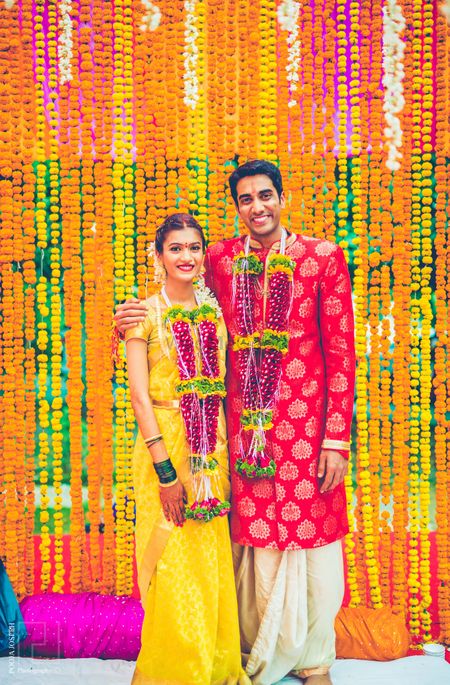 Telugu wedding couple with floral strings