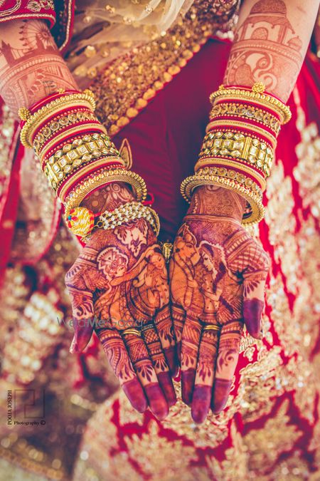 Bride and groom mehendi portraits on both hands