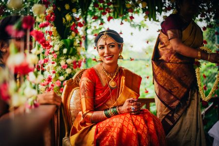 South Indian bride in orange saree 