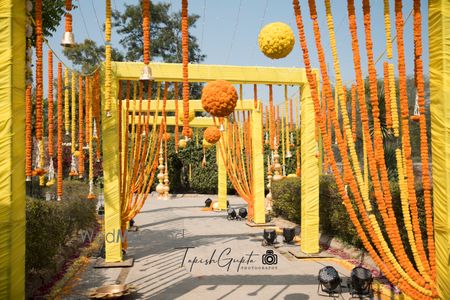 Entrance way decor with marigolds in yellow and orange