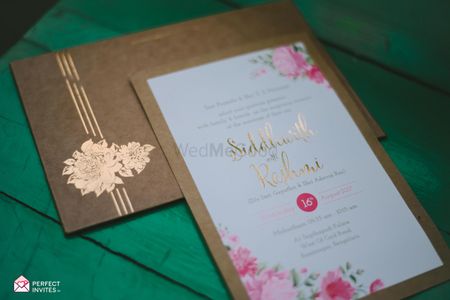 Floral and brown paper themed wedding invites