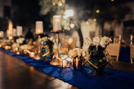 Terrariums filled with flowers used as table centrepieces.