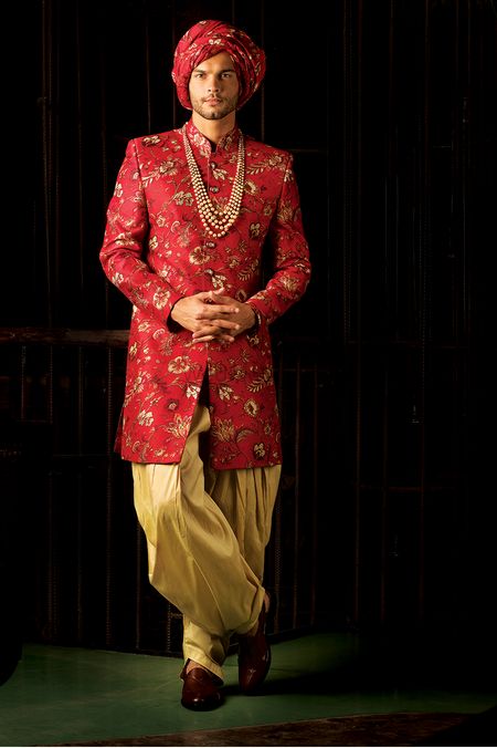 Red floral sherwani and turban for groom