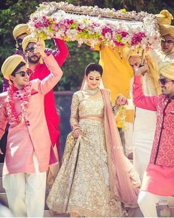 Photo of A bride enters under a phoolon ki chaadar with her brothers