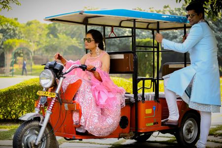 couple entry on mehendi with bride driving golf cart
