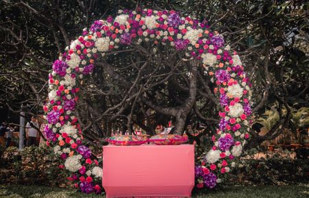 Giant floral wreath as mehendi or engagement photobooth 
