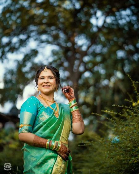 South Asian Indian Bride with mehndi heena hands holding pan betel nut and  coin of one rupee in urban wedding ceremony India Stock Photo - Alamy
