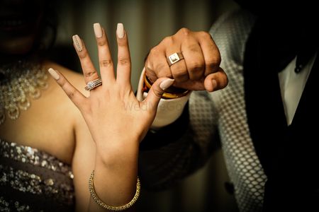 A unique engagement ring photo idea for couples