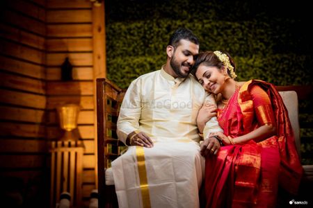 Photo of South Indian bride and groom share a candid moment at their engagement.