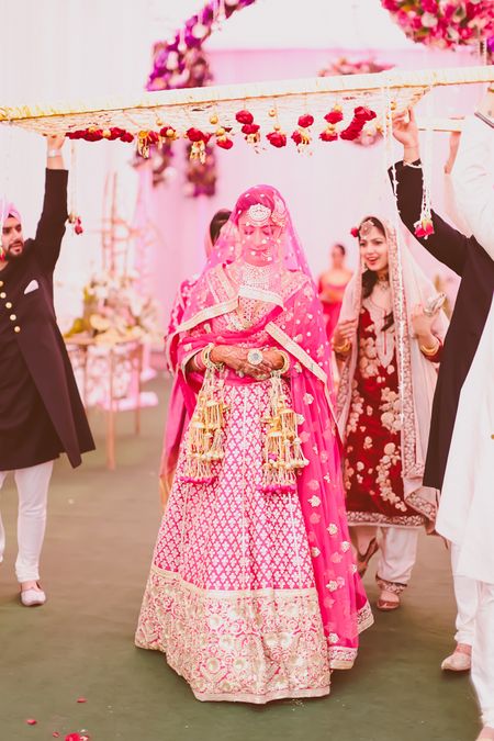 Photo of bright pink bridal lehenga