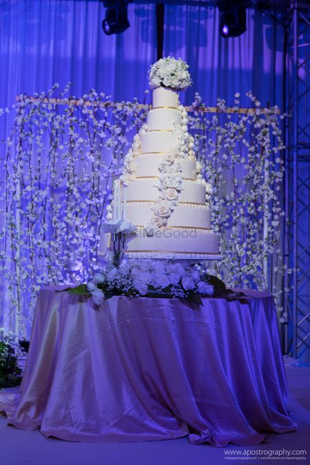 Photo of 7 Tier White Wedding Cake with Floral Cake Decor