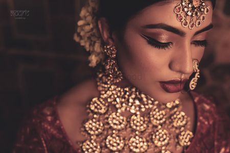 A bride in polki and jadau jewellery for her wedding day 