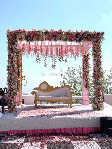 An elegant stage decor setup with suspended flowers 