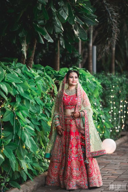 Stunning red bridal lehenga with floral embroidery for wedding 