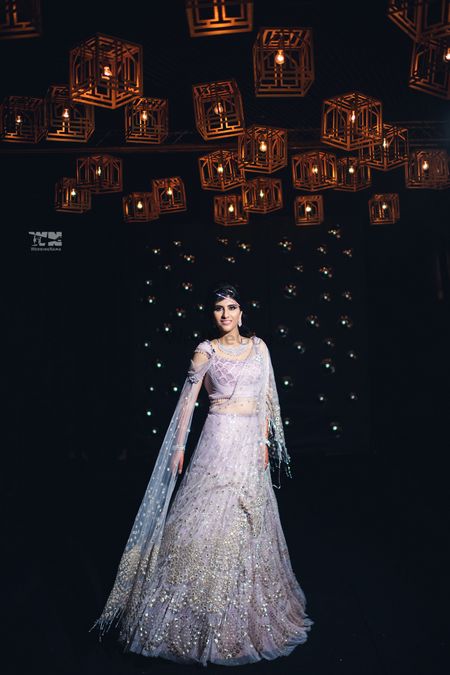 Photo of Bride wearing white lehenga with sequins work.