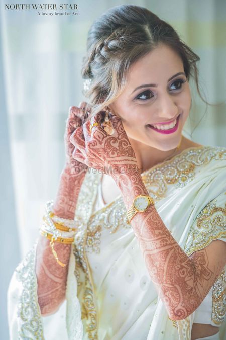 Bride in White and Gold Beaded Engagement Sari