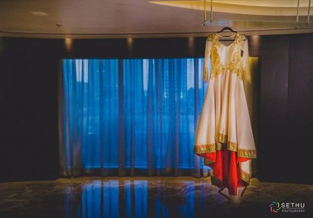 Photo of Cream and Gold Anarkali on a Hanger