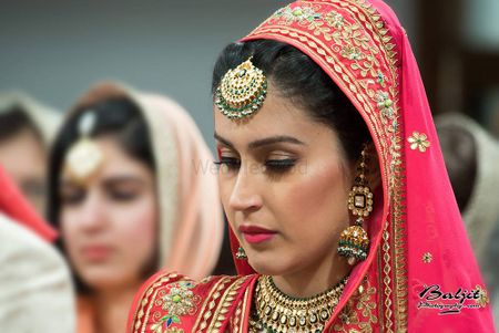 Photo of Pink Bride with Gold and Emerald Maangtikka