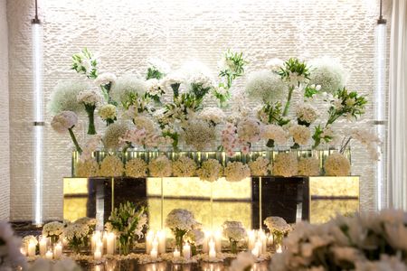 White and green floral installation at reception
