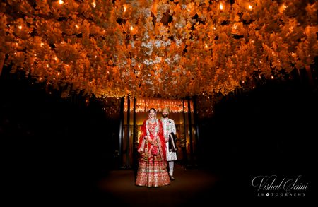 Wedding day couple portrait with grand ceiling decor