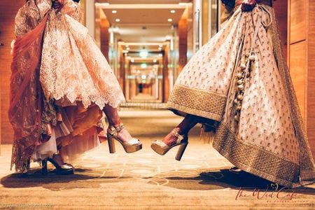 Cute bride with sister photo showing off heels