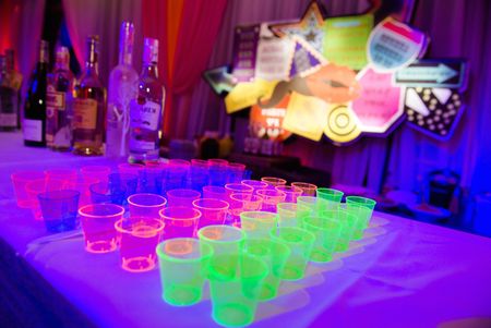 Photo of Neon glow in the dark shot glasses for cocktail