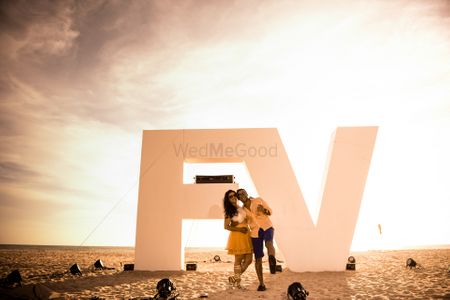 Photo of Beach pre wedding shoot with monograms