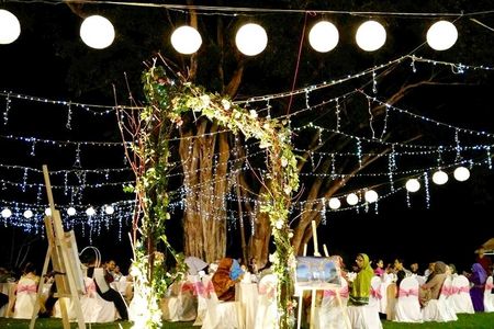 Photo of destination wedding fairy lit decor