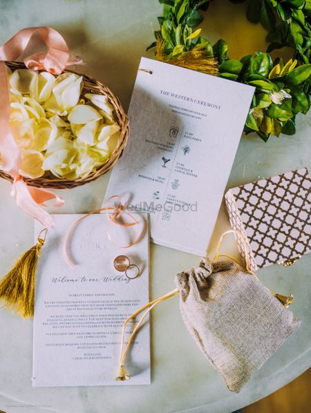 A simple wedding invite in white and gold
