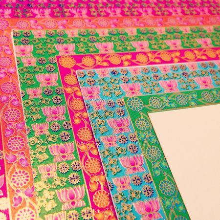 bright pink and green multicolored border inserts. Indian funky invites
