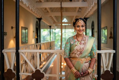 A south Indian bride in a unique colored kanjeevaram for the wedding 