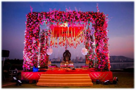 Photo of Pink Floral Mandap with Red Floral Chandelier
