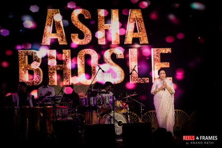 Photo of Asha Bhonsale singing at wedding