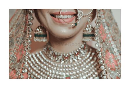 Photo of A close-up shot of bride smiling so wide on her wedding day