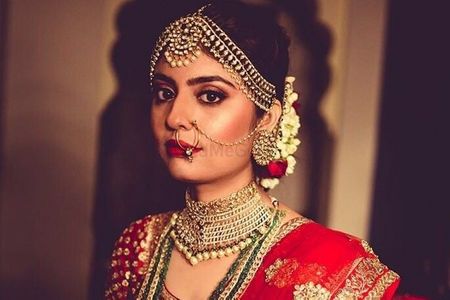 Photo of Silver bridal jewellery with statement mathapatti and choker necklace