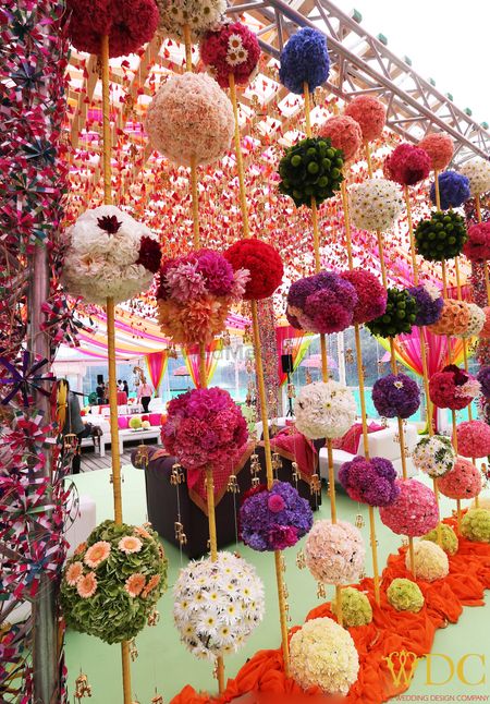 Photo of Bright and colorful floral balls for mehendi decor