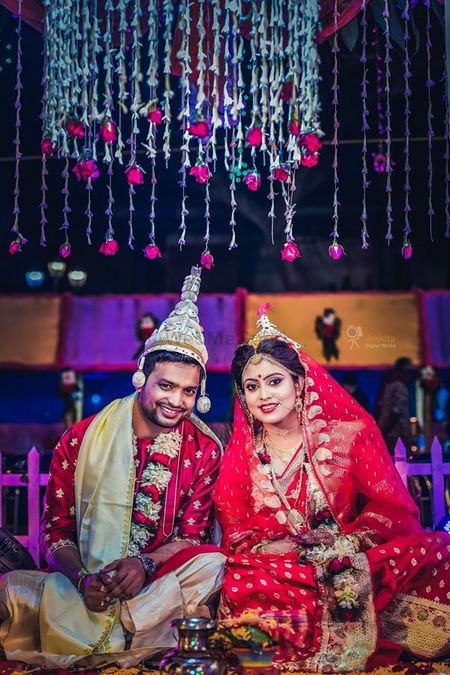 A happy bengali couple on their wedding day.