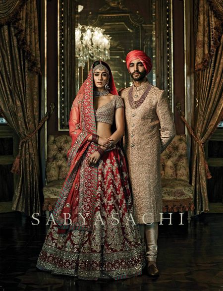 Photo of Red Sabyasachi bridal lehenga with florals | Bridal lehenga red, Sabyasachi  bridal, Indian wedding outfits
