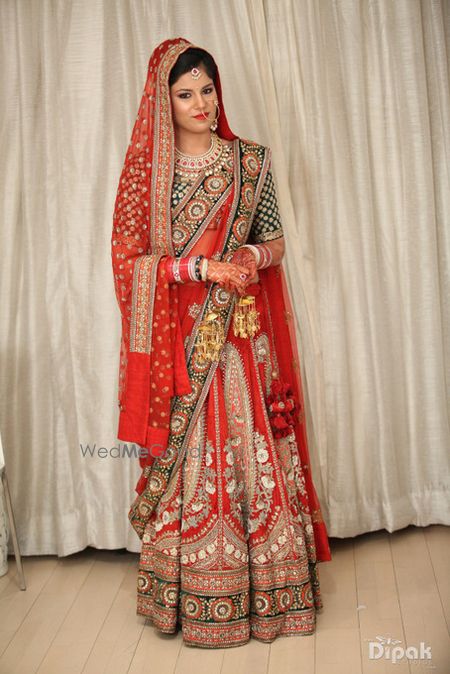 red bridal lehenga by Sabyasachi. Red velvet lehenga