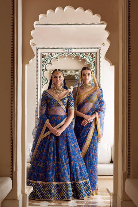 Photo of Ink blue and gold floral bridal lehenga by Sabyasachi