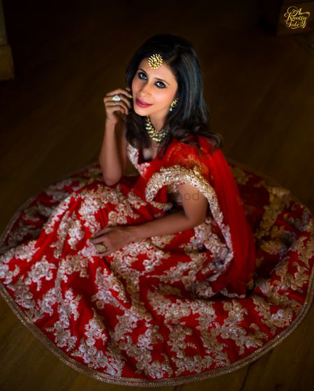 Photo of red and gold engagement lehenga