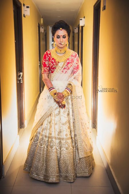 Off white bridal lehenga with red blouse 