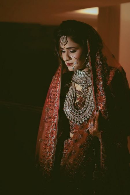 Silver jewellery with a red lehenga 