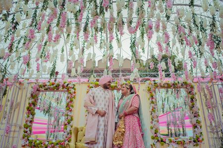 Pastel couple and decor with floral strings 