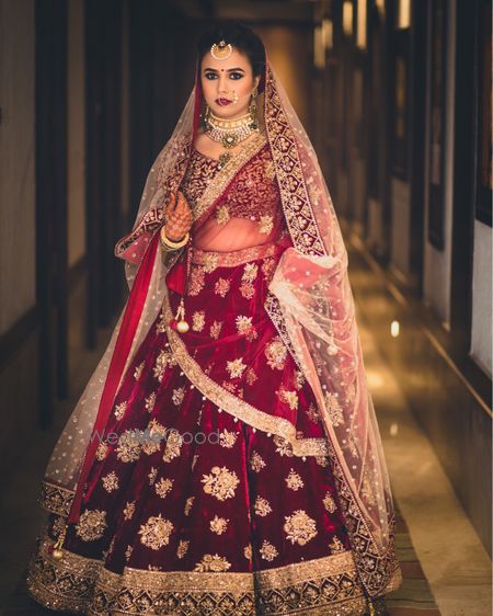 Marsala and gold bridal lehenga