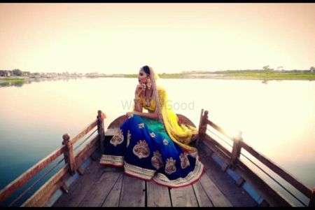 Unique bridal lehenga with yellow blouse and green and blue skirt