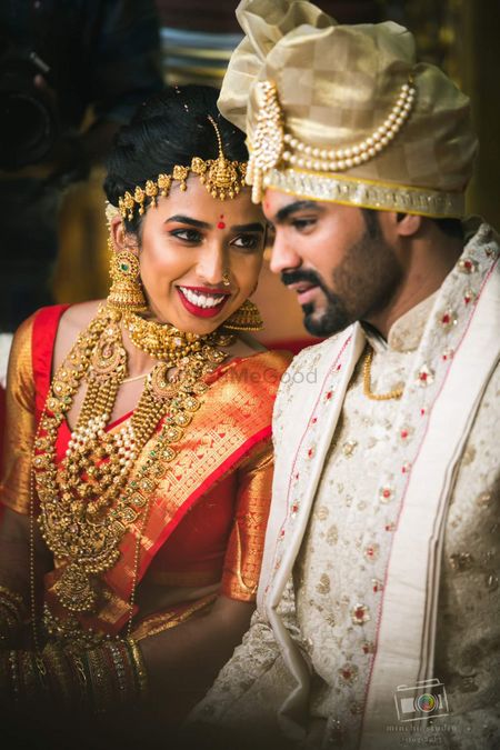 A south Indian bride wearing heavy temple jewelry
