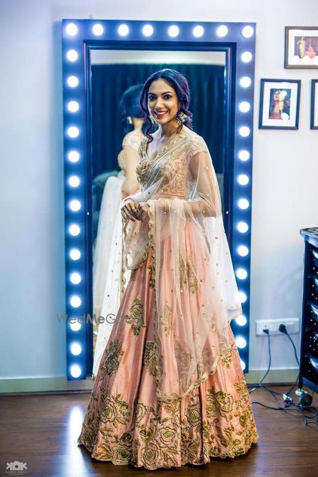 Photo of Soft pink and gold lehenga by Mrunalni Rao