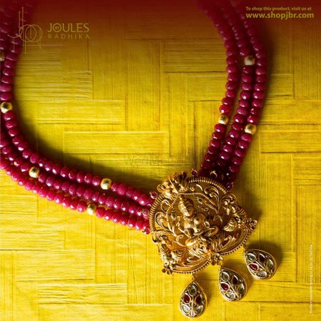 Gold temple jewellery with maroon beads